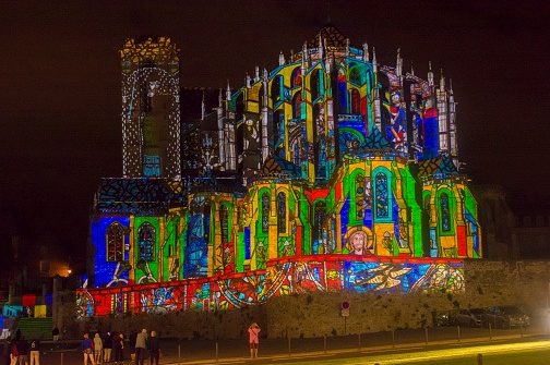 Night of chimera Illuminated perfomance on the wall of Roman and gothic cathedral Saint Julien at Le mans les chimeres du vieux mansl a nuit des chimères au mans. cathédrale saint julien